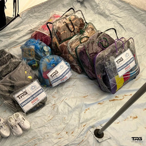 Collection of The Real Guys  emergency response bags on a tarp