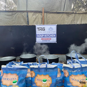 The Real Guys and Al-Qulub Trust soup kitchen with steaming cooking pots in South Gaza