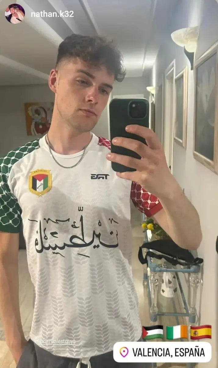 Man wearing Palestine football t-shirt white in Valencia Spain